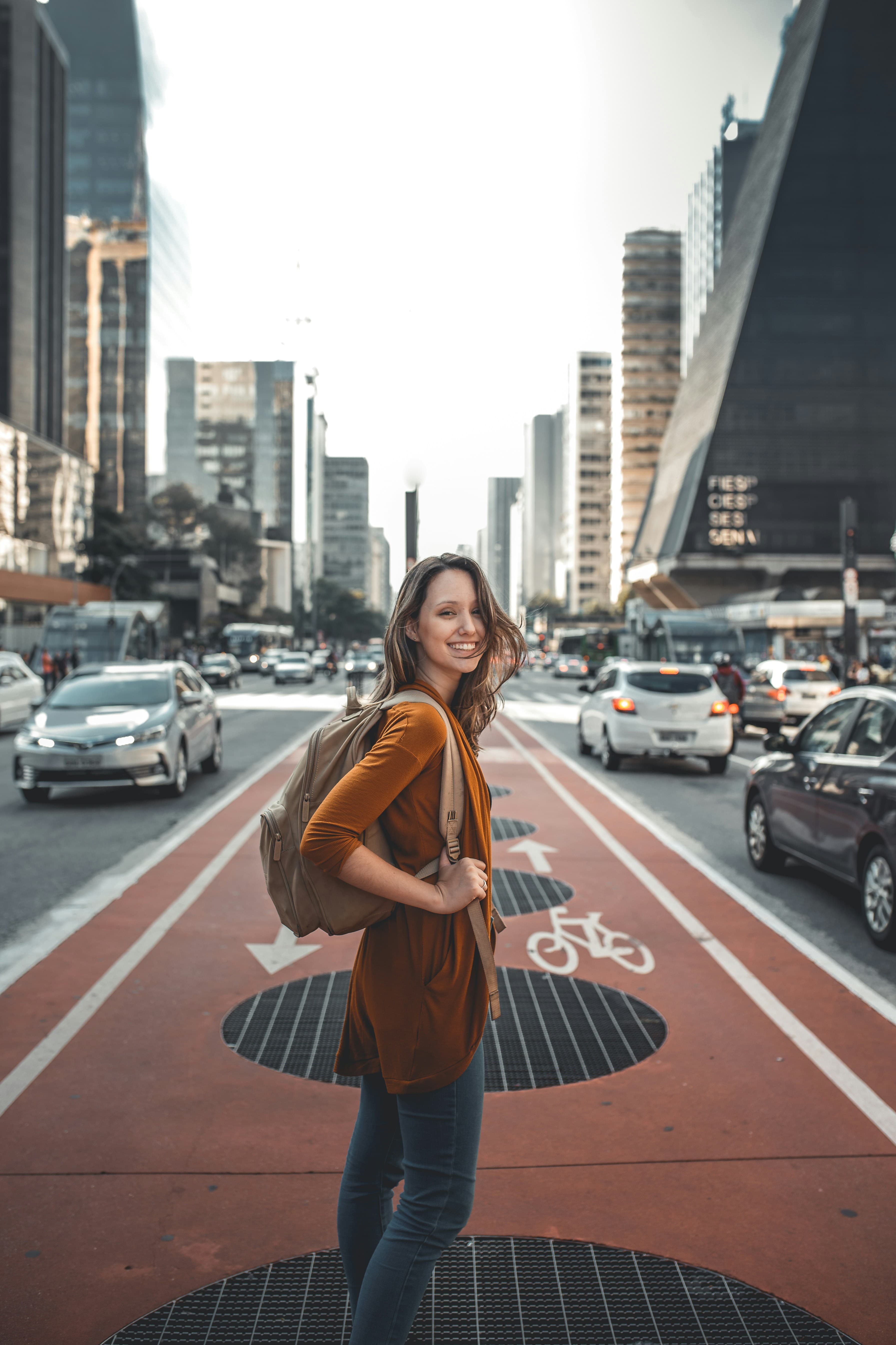 Traveller looking back while exploring a city street